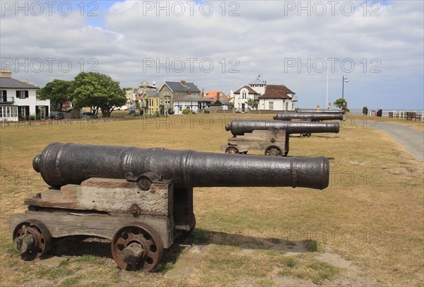 18th Century 18-pounder guns on seafront of seaside town