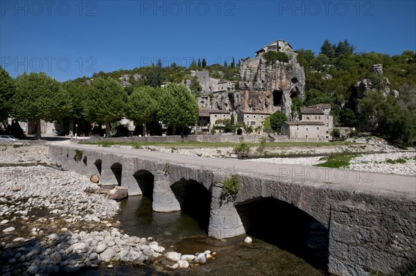 View of the bridge over the river and the village