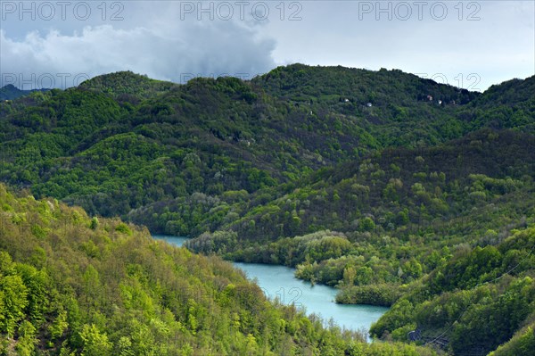 View of wooded hills and lake