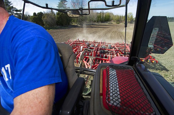 Case MXM 155 tractor cab interior with Vaderstad NZ-Aggressive-700 harrows