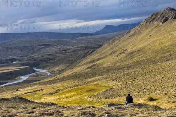 Man looking at the panorama of Torres del Paine National Park