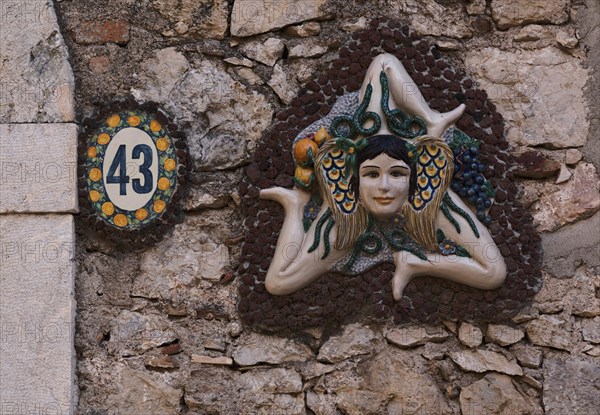 Trinacria on a wall