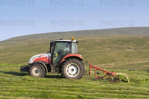 Steyr tractor with tedder