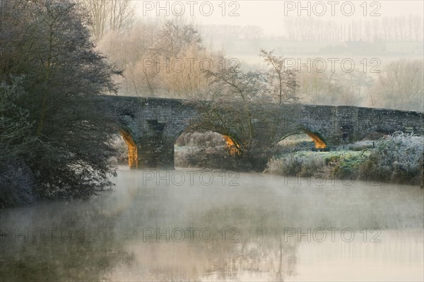 Bridge over the river at dawn
