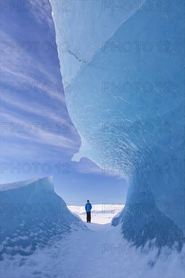 Tourist and ice formation in the glacier lagoon Fjallsarlon