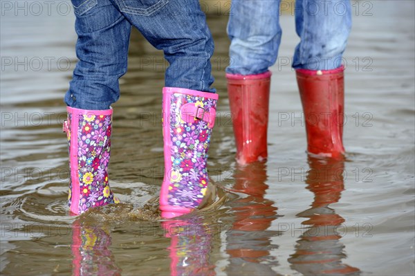 Children playing in puddle