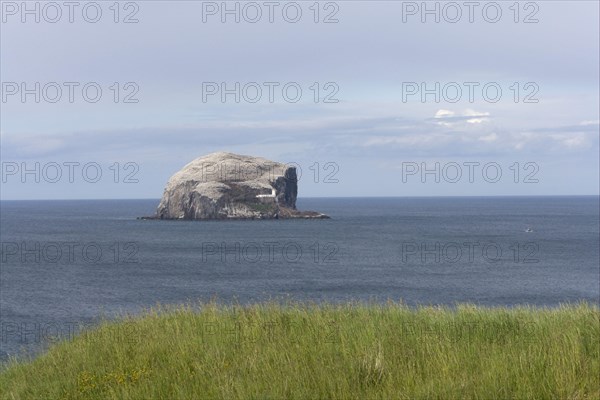 View of volcanic plug island and sea