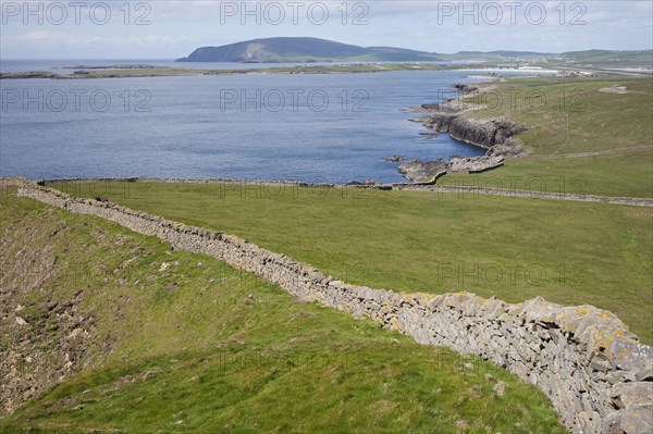 View of dry stone walls and coastline