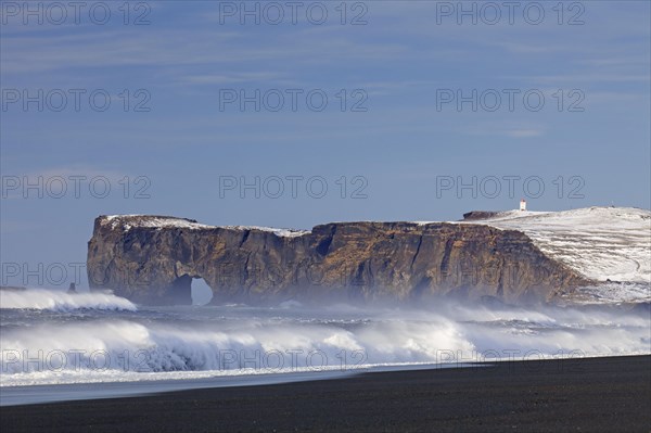 Black lava arc near Vik i Myrdal on the Dyrholaey peninsula in winter