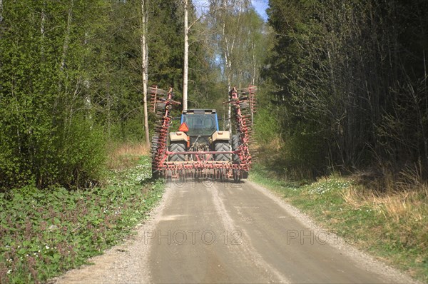 Tractor with harrow