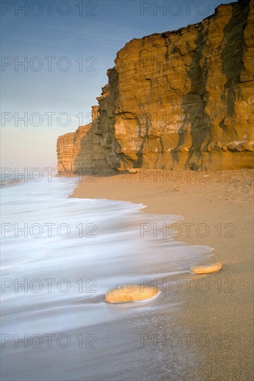 View of sandy beach and sea cliffs