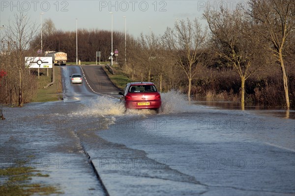 Driving through flooded country lane