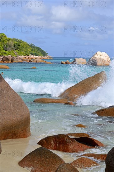 Beach and rocks of Anse Lazio in the evening