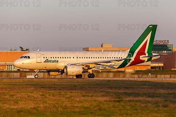 An Alitalia Airbus A319 aircraft with registration EI-IMH at Milan Linate Airport