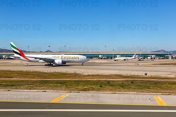 An Emirates Airlines Boeing 777-200LR aircraft with registration A6-EWF at Barcelona Airport