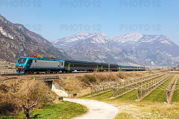 Trenitalia EuroCity train on the Brenner railway near Avio in Italy