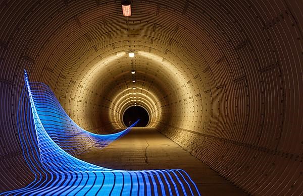 Round tunnel with light wave