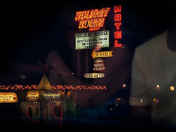 View from bus of neon lights and two hearts