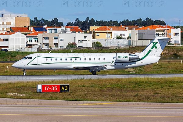 A Bombardier Challenger 850 aircraft of Air X Charter with registration number M-ABJA at Porto Airport