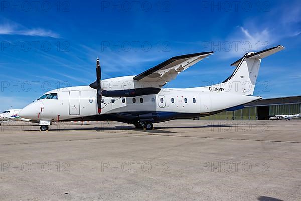 A Dornier Do-328 aircraft of Private Wings with the registration D-CPWF at Stuttgart Airport