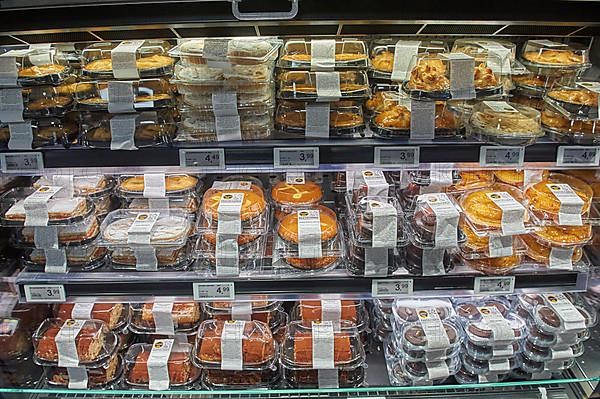 Shelf with pre-packed cake and pie pieces