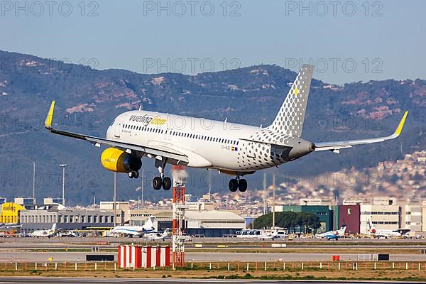 A Vueling Airbus A320 with registration EC-MJB lands at Barcelona Airport