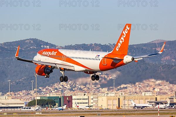 An EasyJet Europe Airbus A320 with registration OE-IVJ lands at Barcelona Airport