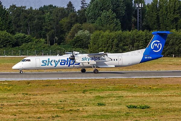 A De Havilland Canada Dash 8 Q400 aircraft from SkyAlps with registration 9H-EVA at Hamburg Airport