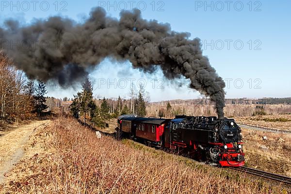 Steam train of the Brockenbahn railway leaving Drei Annen Hohne