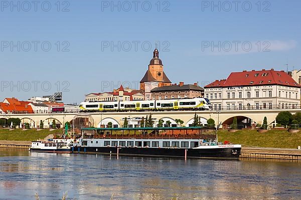 Landsberg an der Warthe town on the river with a Newag Impuls 2 regional train in Gorzow Wielkopolski