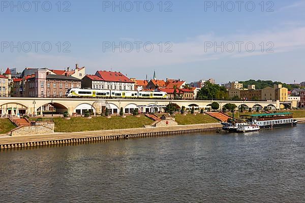 Landsberg an der Warthe town on the river with a Newag Impuls 2 regional train in Gorzow Wielkopolski