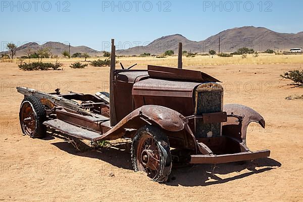 Wreck of a classic car in the desert