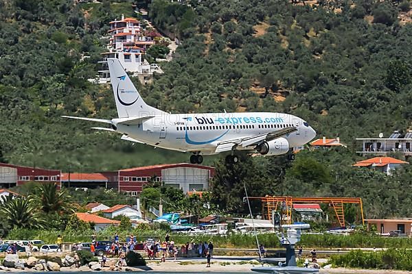 A Boeing 737-300 aircraft of Blu Express with registration number I-BPAM lands at Skiathos airport