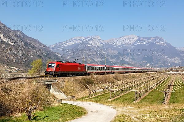 OeBB EuroCity train on the Brenner railway near Avio in Italy