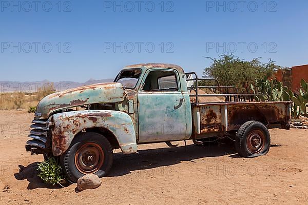Wreck of a classic car in the desert