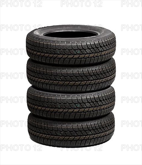 Set of winter car tires isolated on white background