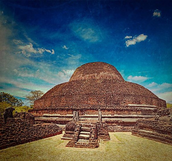 Vintage retro hipster style travel image of ancient Buddhist dagoba