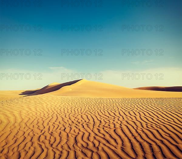 Vintage retro hipster style travel image of dunes of Thar Desert. Sam Sand dunes