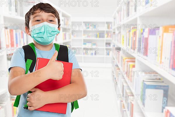 Young Pupil Child Boy With Mask Against Corona Virus Corona Virus In School Showing Thumbs Up With Text Free Space Copyspace in Stuttgart