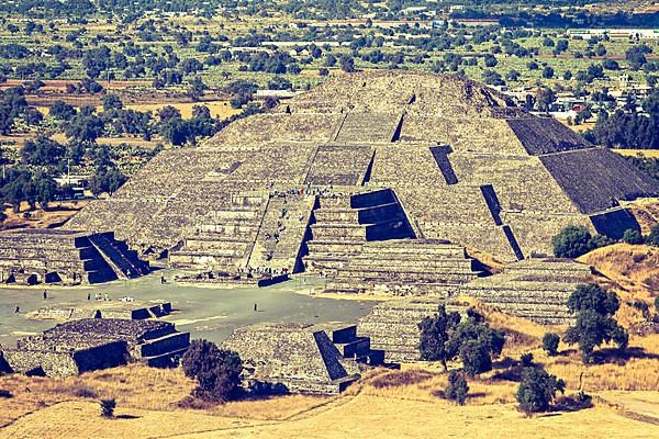 Vintage retro hipster style travel image of Pyramid of the Moon. View from the Pyramid of the Sun. Teotihuacan
