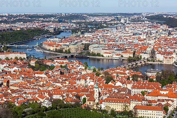 Aerial view of Charles Bridge over Vltava river and Old city from Petrin hill Observation Tower. Prague