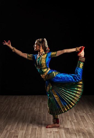 Young beautiful woman dancer exponent of Indian classical dance Bharatanatyam