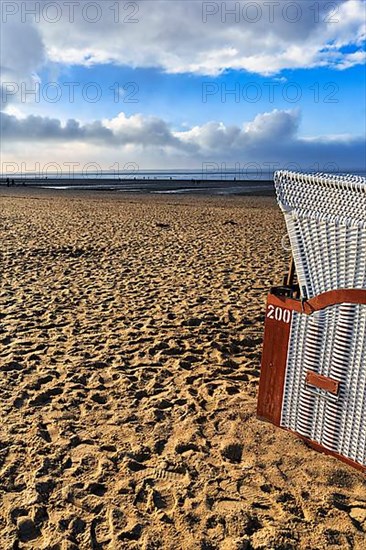 Beach chair on an empty sandy beach