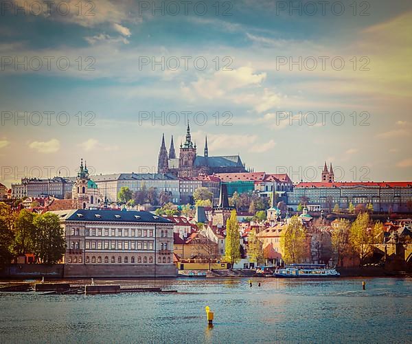 Vintage retro hipster style travel image of Charles bridge over Vltava river and Gradchany