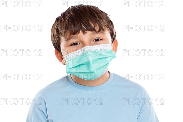 Child boy with mask against coronavirus corona virus portrait face isolated cropped in Stuttgart