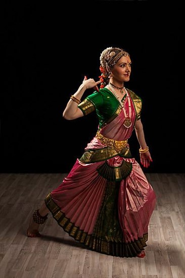 Young beautiful woman dancer exponent of Indian classical dance Bharatanatyam