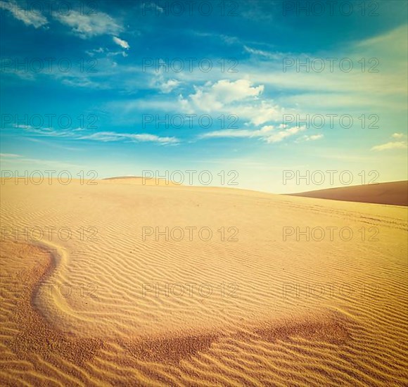 Vintage retro hipster style travel image of white sand dunes on sunrise