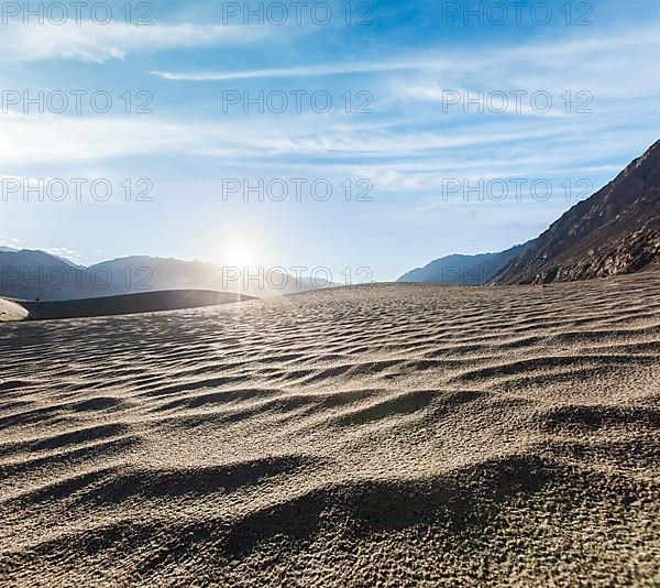 Sand dunes in Himalayas on sunrise. Hunder