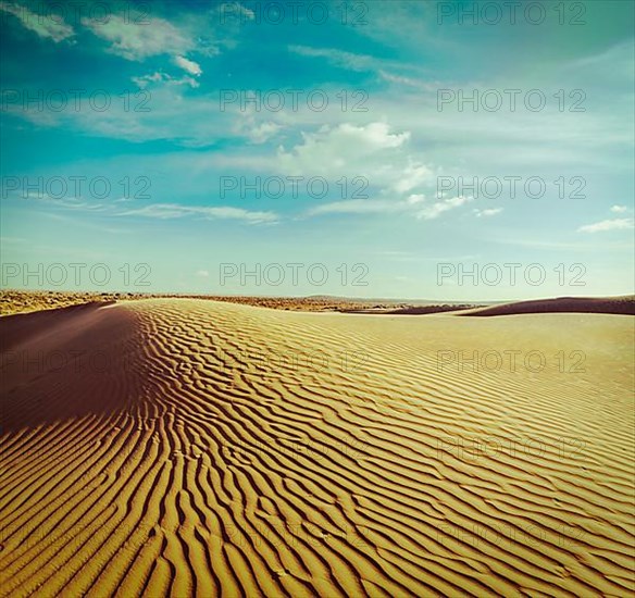 Vintage retro hipster style travel image of dunes of Thar Desert. Sam Sand dunes