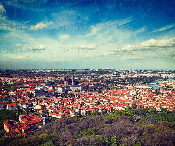 Vintage retro hipster style travel image of aerial view of Hradchany part of Prague: the Saint Vitus